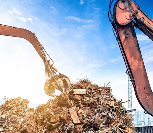 Scrap being lifted at a ScrapVanta collection site